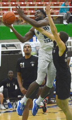 WTC sophomore Tafari Simms battled through an attempted block to score during a game against Strength ‘N Motion Thursday. Simms scored 13 points in the Westerners’ 78-66 win over Angeline College Friday.