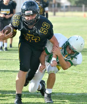 Snyder’s Talon Lee powered his way into the end zone during a scrimmage against Idalou Friday. The Tigers will travel to Slaton for a scrimmage at 5 p.m. Thursday.