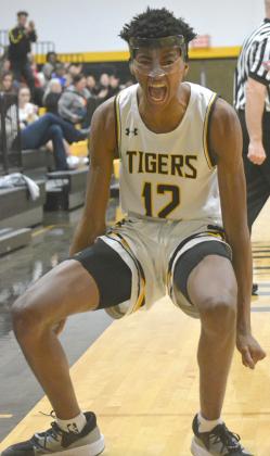 Teafale Lenard reacted after drawing a foul on a jump shot. The Tigers will return to action in the Canyon Reef Snyder Basketball Tournament on Dec. 30.