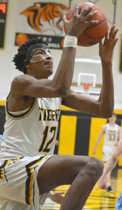 Snyder senior Teafale Lenard drove to the basket during a game this past season. Lenard will continue his playing career at Link Year Prep in Missouri.