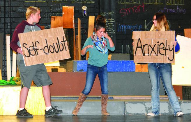 Snyder High School theatre students (l-r) James Wampler, Jacklyn Clinkinbeard and Madison Mitchell rehearse a “movement piece” arranged by Clinkinbeard for Saturday’s Theatre for Change benefit at Worsham Auditorium.