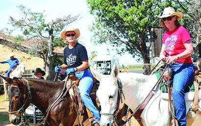 Sisters Fran Ferrell (left) and Dixie Mayer, both from Comanche, begin their horseback trail ride at the Fuller Ranch on Saturday at the fourth annual Long Ear Benefit Trail Ride benefitting the Ben Richey Boys’ Ranch.