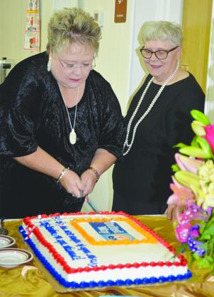 Former Scurry County United Way President Kellye Starnes (left) cut a retirement cake honoring Executive Secretary Peggy Vernon (right) during Tuesday’s Be A Hero campaign luncheon. Vernon retired this month after serving as executive secretary for eight years.