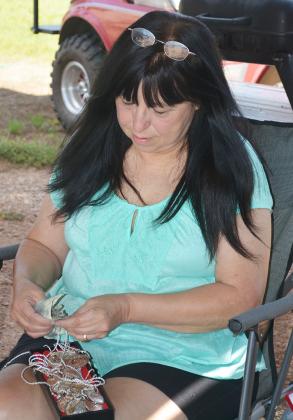 Vendor Norma Jean Leigh, of Amarillo, polished jewelry for the West Texas Western Swing Festival. The event will begin Wednesday night with the annual burgers and bean welcome dinner and informal jam session at The Coliseum.
