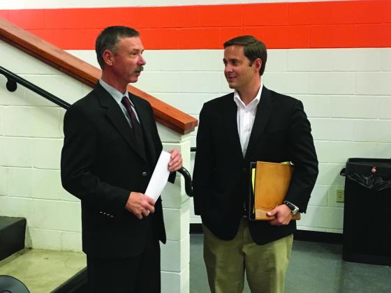 Ira ISD Superintendent Jay Waller (left) and Rep. Dustin Burrows, R-Lubbock, discuss school funding in Bulldog Country, the school district’s new gymnasium. Waller invited Burrows to the school to hear concerns about cutting Additional State Aid for Tax Reduction (ASATR) beginning with the 2017-18 school year.