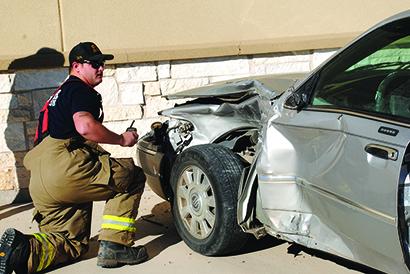 Two unrelated accidents occurred in the 4200 block of College Ave. at 9:42 a.m. Saturday. Snyder firefighter Nathan Evans assessed the damage to a vehicle that drove into the side of the Wes-T-Go convenience store.