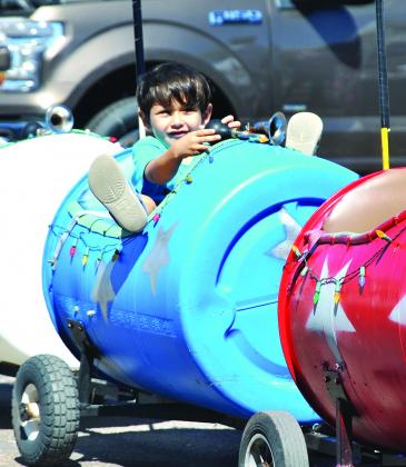 Bastian Martinez, 5, enjoyed a miniature train cart ride around the downtown square during Saturday’s White Buffalo Days. 