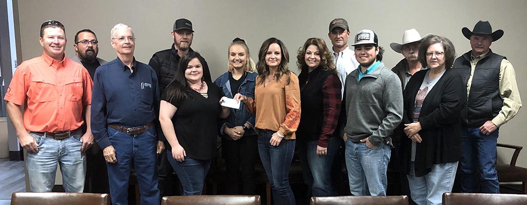 Western Texas College’s Agriculture program members Jessica Vogel and Stephanie Wirts (fifth and sixth from left) received a scholarships check from Hunter Appreciation board members Tuesday. Pictured are (l-r) Reese Grimmett, Kenny Miller, Drew Bullard, Jason Bynum, Vogel, Wirts, Jamie Price, WTC teacher Jessica Colvin, Brad Hart, Matthew Gonzales, Richard Kruger, Melissa Kruger and Dennis Taylor